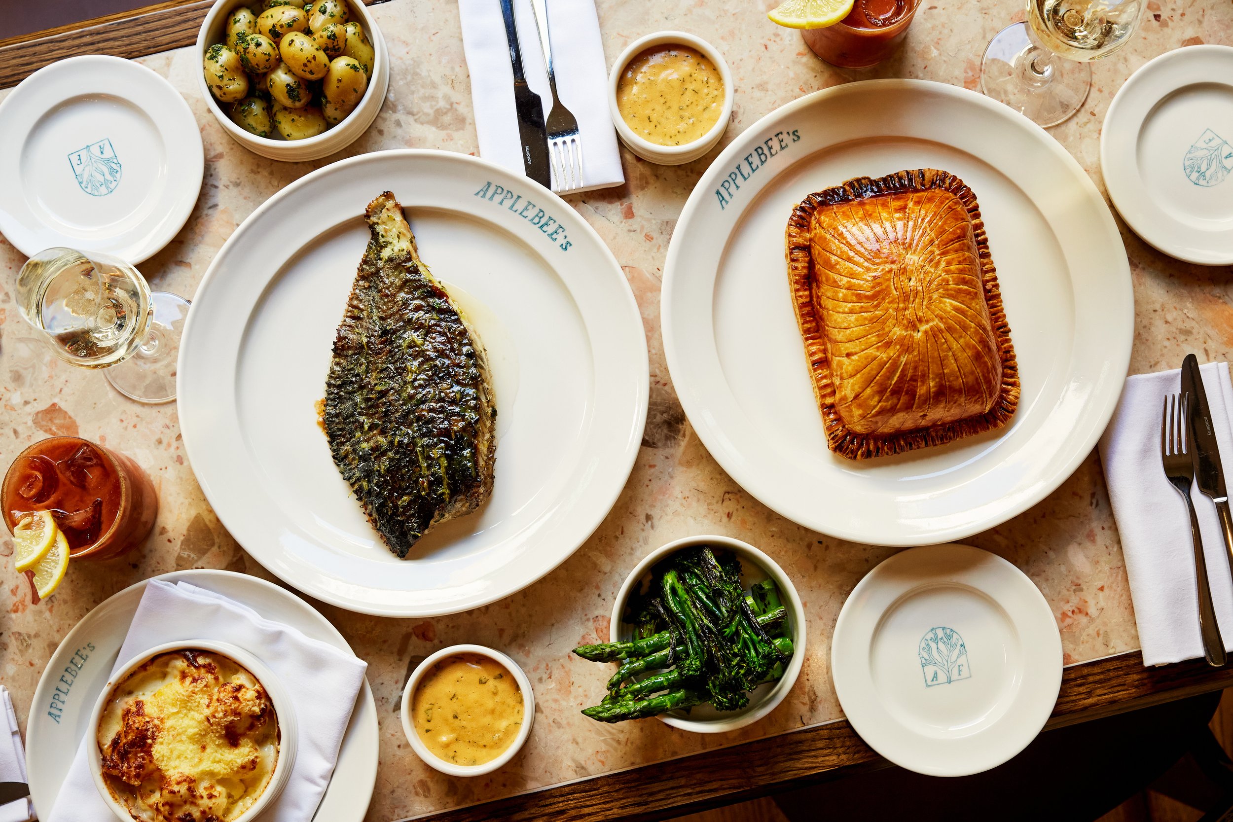 Table set with British seafood dishes at Applebee's